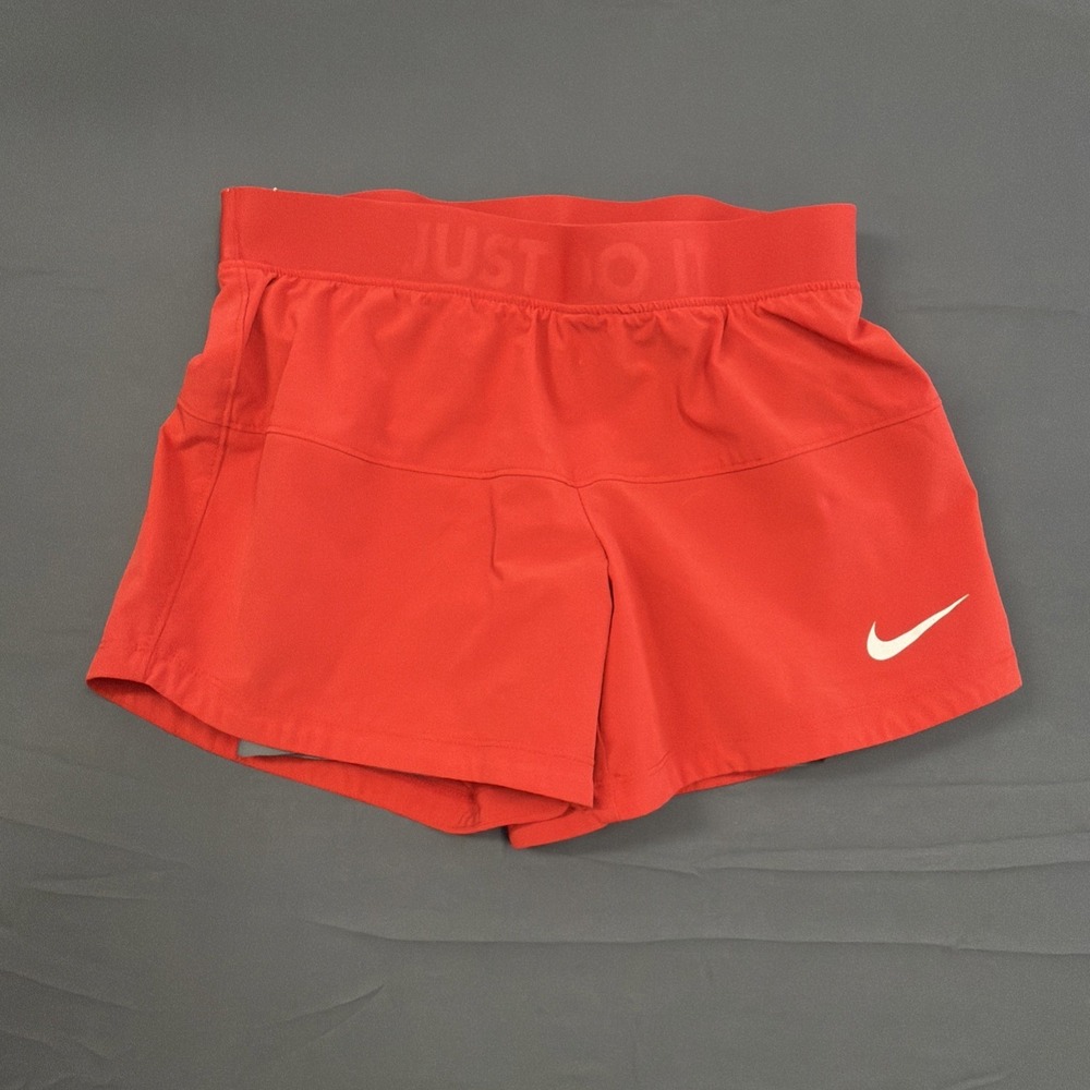 red Nike Dri-FIT 2-in-1 shorts featuring a wide waistband with "JUST DO IT" XS